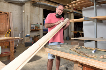 a carpenter working in his workshop