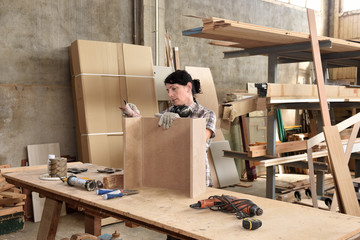 a woman working in a carpentry workshop