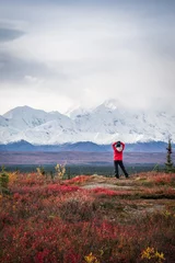 Papier Peint photo autocollant Denali Hiker posing in front of Mount Denali