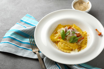 Fresh ravioli with mushrooms in white plate