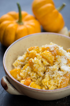 Closeup of pumpkin risotto with parmesan cheese, selective focus, shallow depth of field