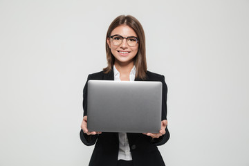 Portrait of a young attractive businesswoman in suit