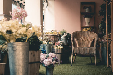 wooden arm chair and decoration flower interior with vintage tone.