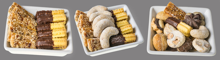 Collection of traditional homemade Christmas cookies. Ornate shapes of sweet pastries. Isolated on gray background.