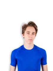 Handsome teen boy  looking at camera. Portrait of teenager, sport, workout concept, white background