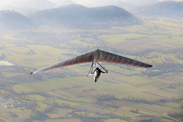 man his hang glider above the plain