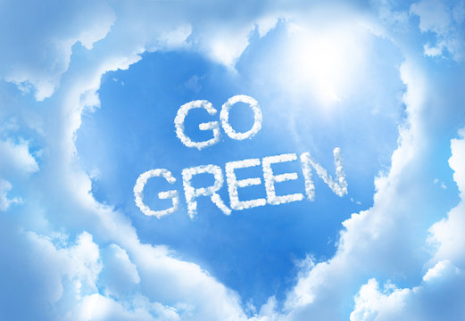 Go green,cloud word inside heart cloud frame on blue sky background..