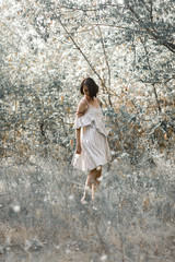 she is dressed in white with black stripes dress