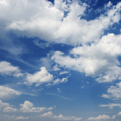 Naklejka na ściany i meble Cumulus white clouds on a blue sky background