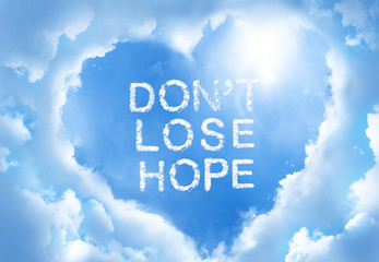 Naklejka na ściany i meble Don’t lose hope cloudword inside heart cloud frame on blue sky background.