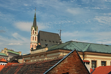 Fototapeta premium Roofs in Cesky Krumlov. St. Vitus Church - UNESCO World Heritage Site, Czech republic