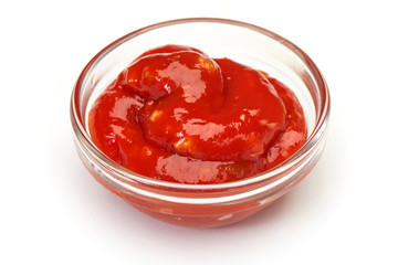 Bowl of ketchup or tomato sauce on white