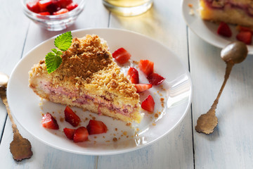 Strawberry crumble pie with on white plate