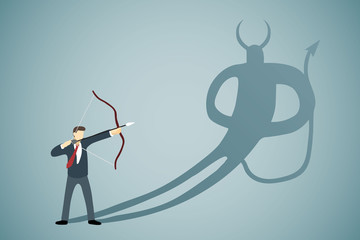 Businessman Aiming bow with arrow to his own Devil shadow