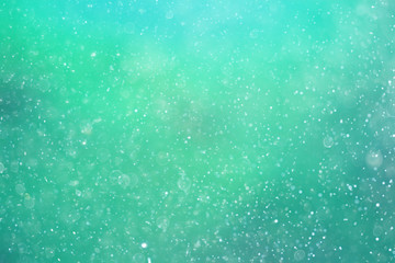Snowfall texture of snowflakes on blurred background