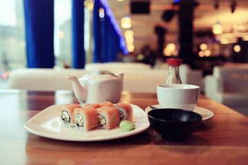 rolls with salmon in a Japanese restaurant
