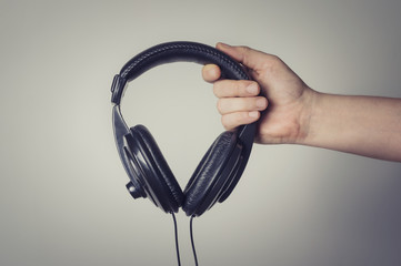 Headphones in hand