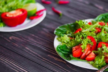 salad of fresh vegetables on a wooden background