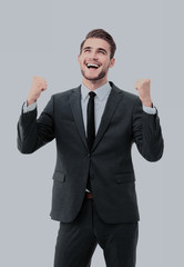 Lucky handsome businessman celebrating. Winner  laughing man