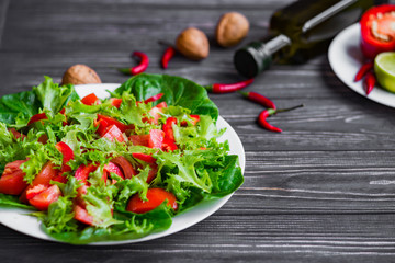 salad of fresh vegetables on a wooden background