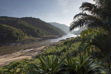 Fototapeta na wymiar Scenic view of river flowing through mountains, River Mekong, Oudomxay Province, Laos
