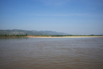 Fisherman pulling his net from the river, River Mekong, Laos