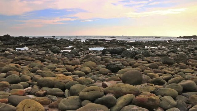 amazing to see on the beach is full of round rocks instead of sand. round rocks have beautiful color.size of rocks have tennis ball until football size.lighthouse landmark of Lanta island Krabi