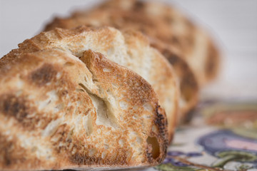 Line of slices of bruschetta.