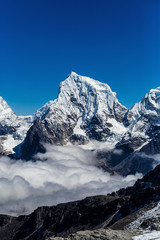 Naklejka premium Mountain in the clouds