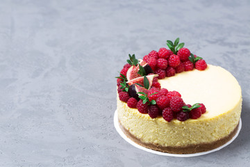 Cheesecake with raspberries and figs on a gray background, raspberry, berries, cake, horizontal, soft focus, sweets
