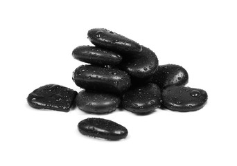 Black spa stones with water drops isolated on white background