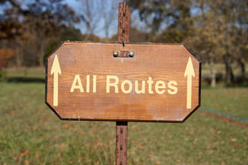 All Routes sign with forward pointing arrows