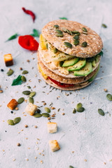 Healthy vegetable sandwich with vegetables on a light background
