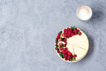 Cheesecake with raspberries and figs on a gray background, raspberry, berries, cake, horizontal, soft focus, sweets
