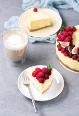 Cheesecake with raspberries and figs on a gray background, raspberry, berries, cake, vertical, selective focus, sweets
