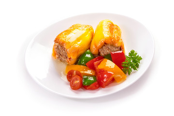 Fried bell pepper with meat on a white plate and black background