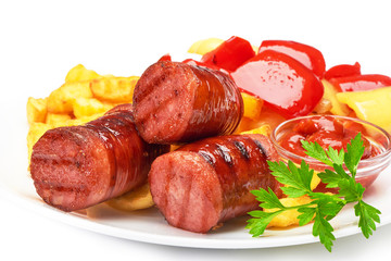 grilled sausages with potatoes fries and sweet bulgarian peppers and red sauce ketchup