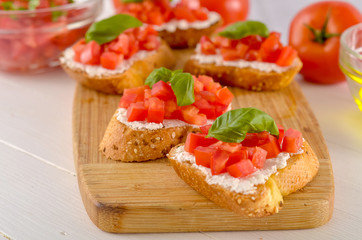 bruschetta with tomato on table