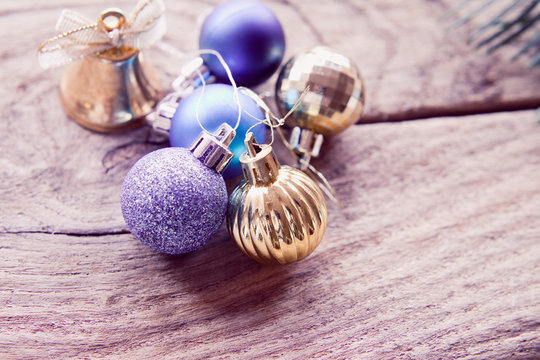 Violet, blue, silver, gold  and purple cold Christmas decorations with baubles.