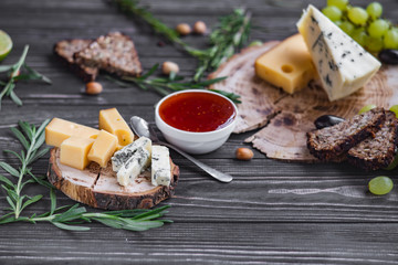cheeses on wood are chopped deliciously and nutritionally