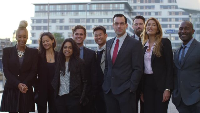  Portrait smiling diverse business group outdoors in the city