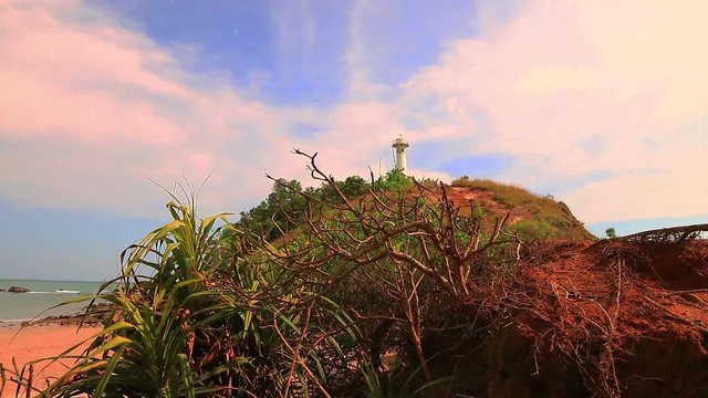 light house landmark of Lanta island.lighthouse is on Tanod cap the end way of Lanta Yai island build on the hill. on the beach around light house full of beautiful round rock.and have many monkey