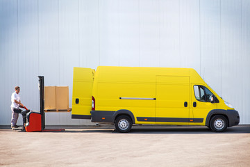 Courier is loading the van with parcels