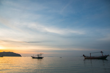 Fototapeta na wymiar Fishermen boat at sunset near Koh Phangan island, Thailand