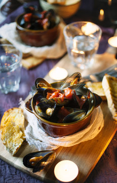 Mussels with tomato and garlic sauce,served with crusty bread.