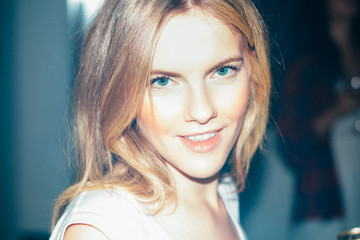 Young Blue Eyed Blonde Haired Woman Smiling At The Camera