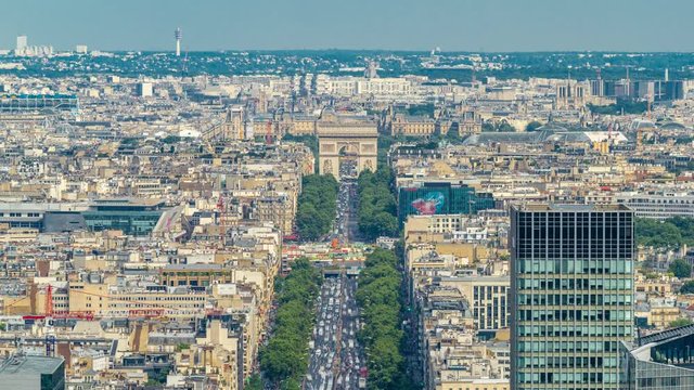 Aerial view of Paris and The Arc de Triomphe with Champs Elysees timelapse from the top of the skyscrapers in Paris business district La Defense