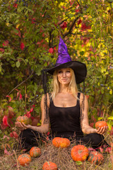 Adult girl in Halloween costume practicing yoga