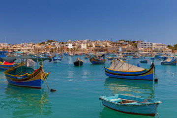 Fototapeta na wymiar Malta. Marsaxlokk. Traditional fishing boats.