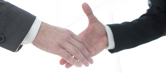 Two  business men going to make handshake